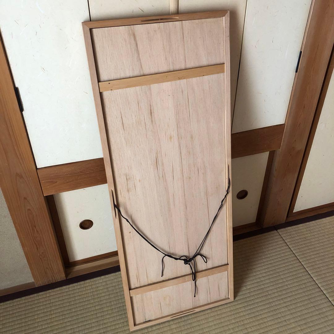 額入りの人物画手拭い