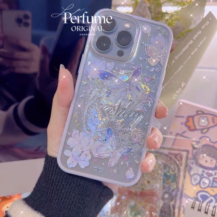 バタフライ✨名入れ♡キラキラ✨レインボー 花 イニシャル フチiPhoneケース
